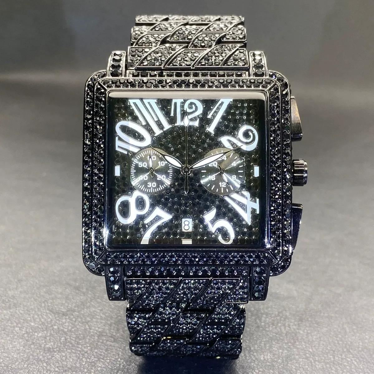 Moissanite watch with a square case stylized numerals.