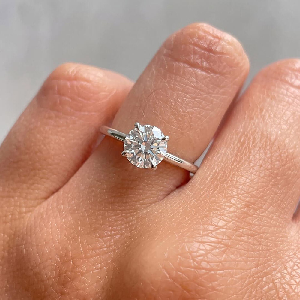 Classic Four-Prong Round Moissanite Ring