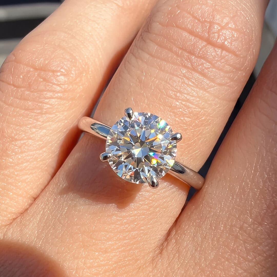 Classic Four-Prong Round Moissanite Ring
