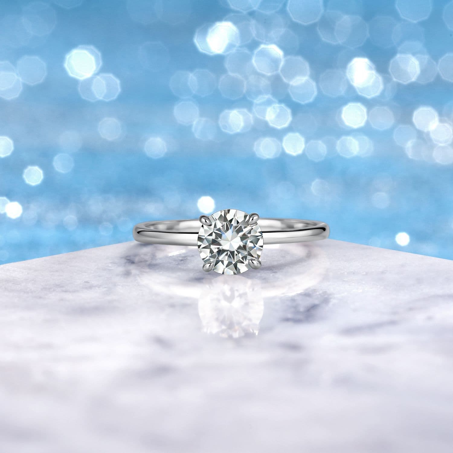 Classic Four-Prong Round Moissanite Ring