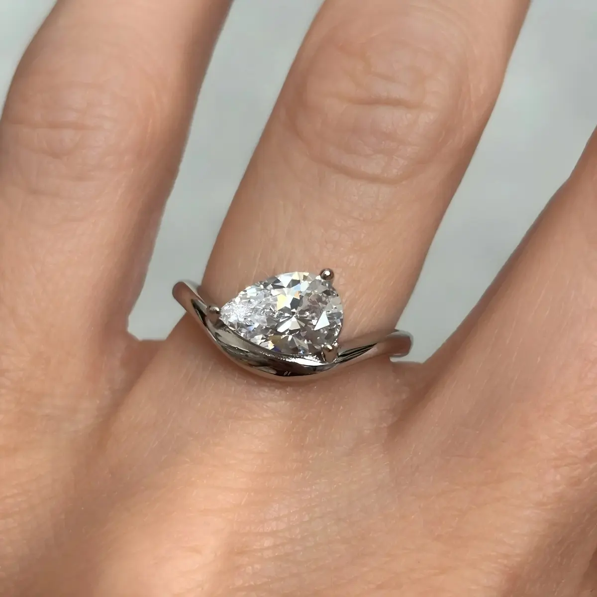 Classic Curved Pear Moissanite Ring