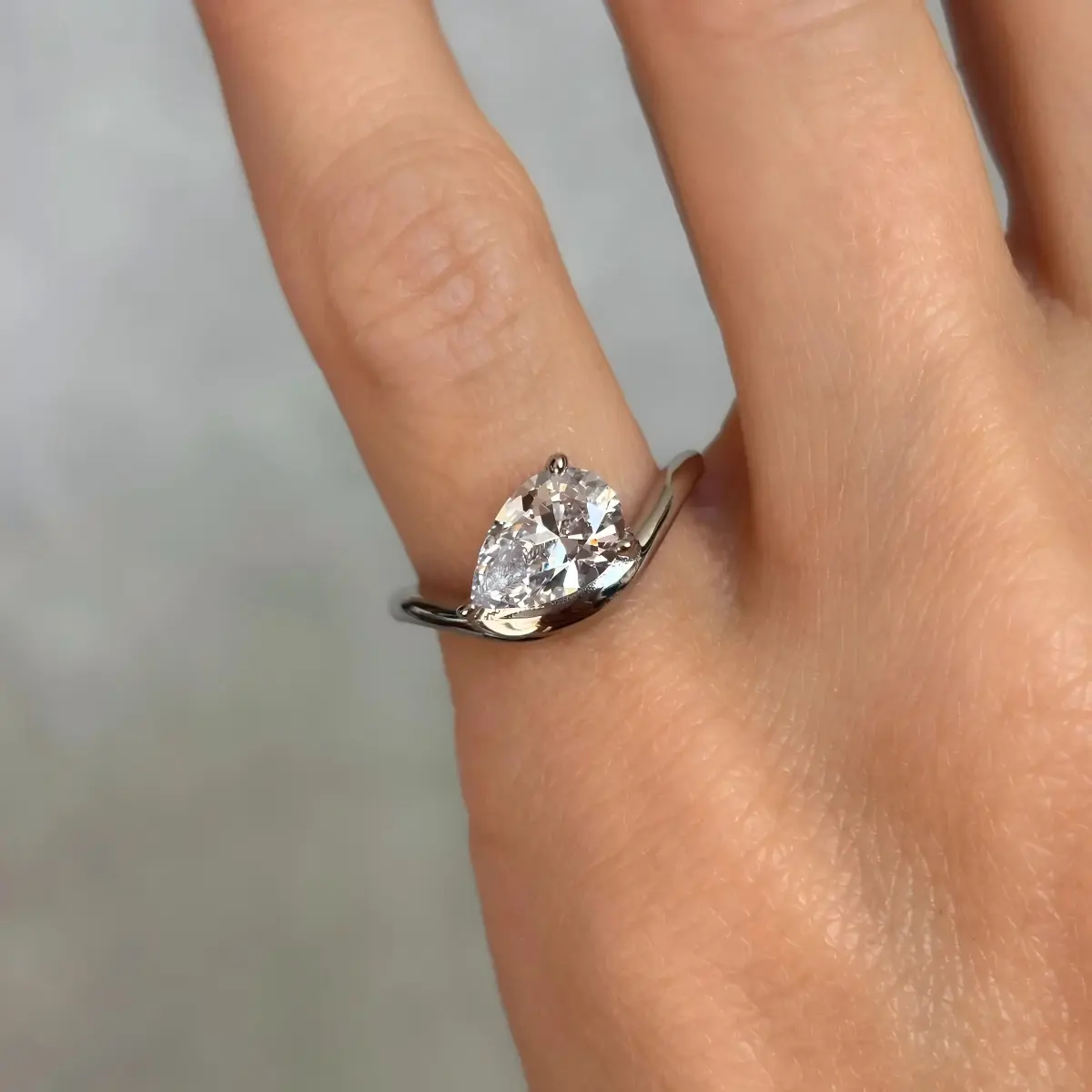 Classic Curved Pear Moissanite Ring