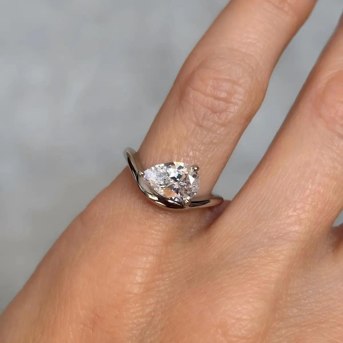 Classic Curved Pear Moissanite Ring