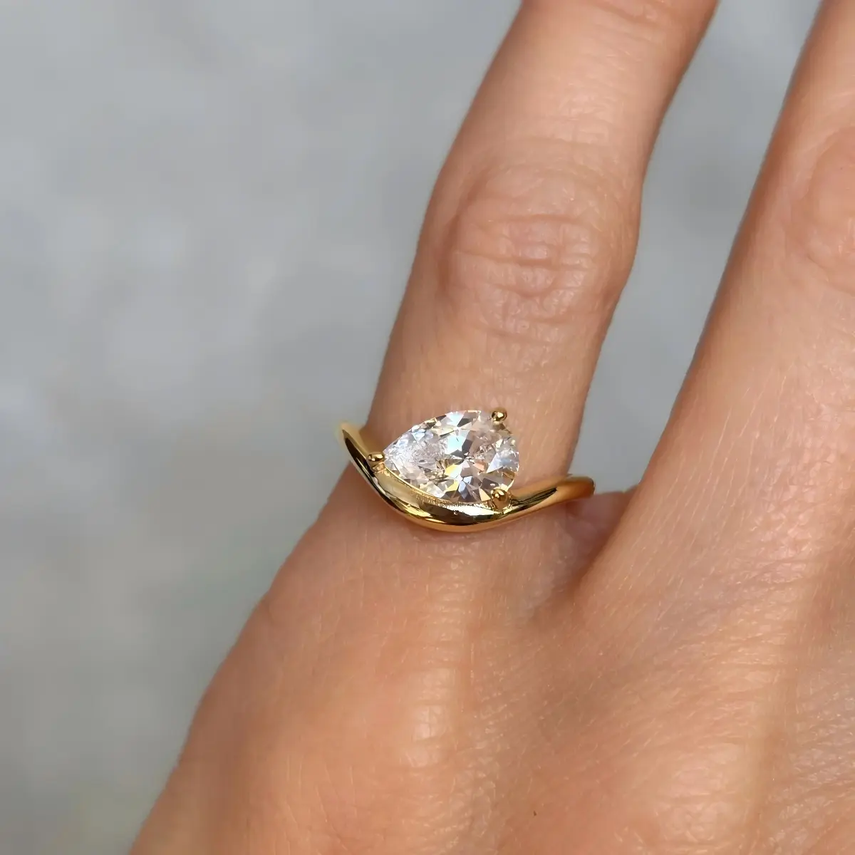 Classic Curved Pear Moissanite Ring