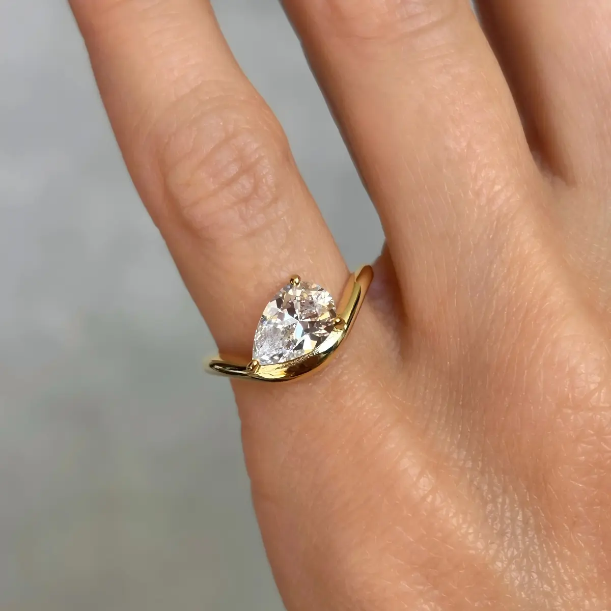 Classic Curved Pear Moissanite Ring