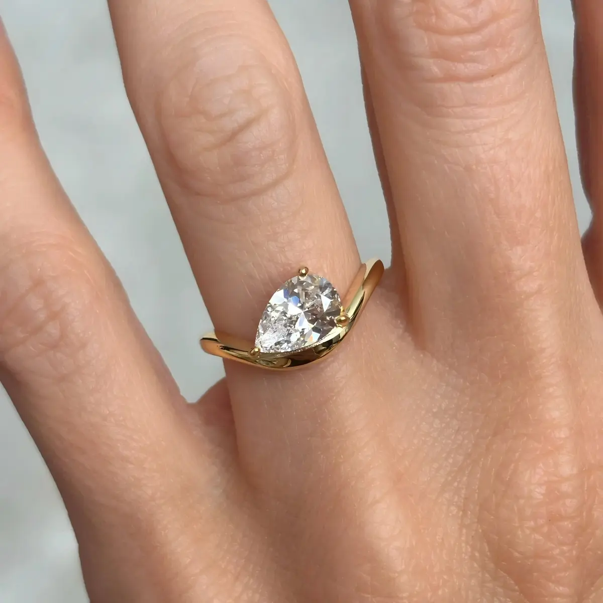 Classic Curved Pear Moissanite Ring