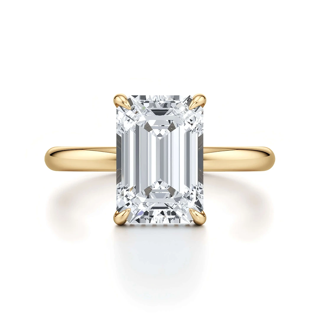Classic Four-Prong Emerald Moissanite Ring