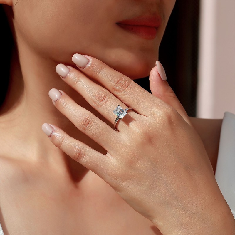 Classic Four-Prong Emerald Moissanite Ring