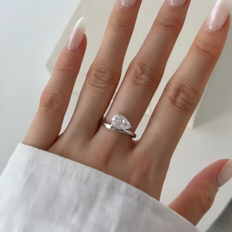 Curved Pear Moissanite Ring
