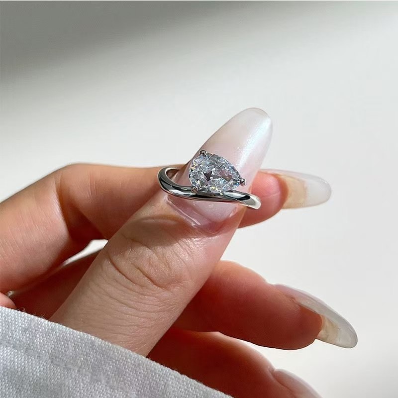 Curved Pear Moissanite Ring