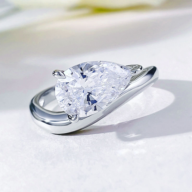 Curved Pear Moissanite Ring