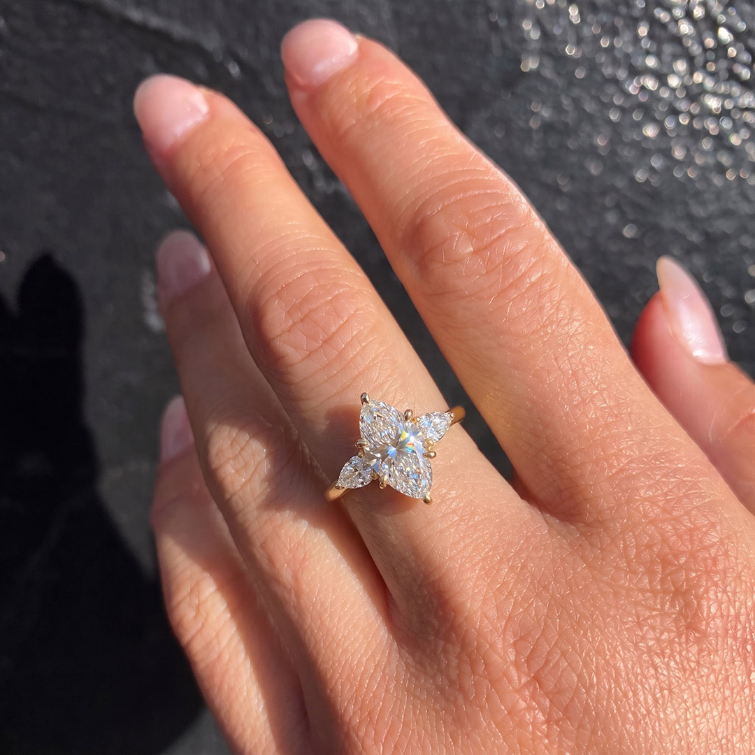 Opera Three-Stone Marquise Moissanite Ring