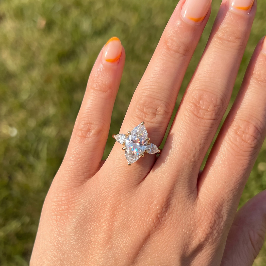 Opera Three-Stone Marquise Moissanite Ring