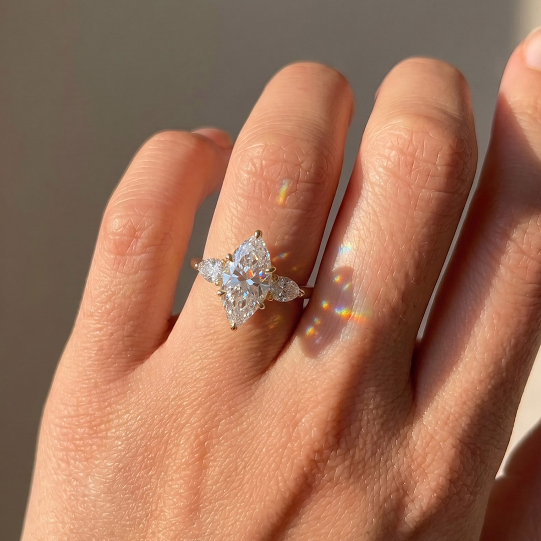 Opera Three-Stone Marquise Moissanite Ring