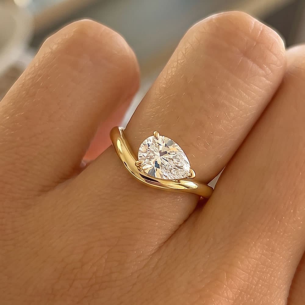Curved Pear Moissanite Ring