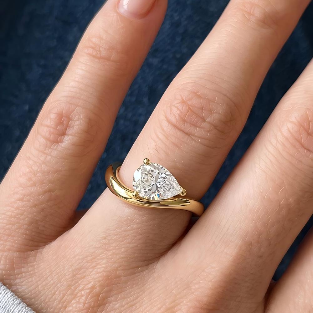 Curved Pear Moissanite Ring
