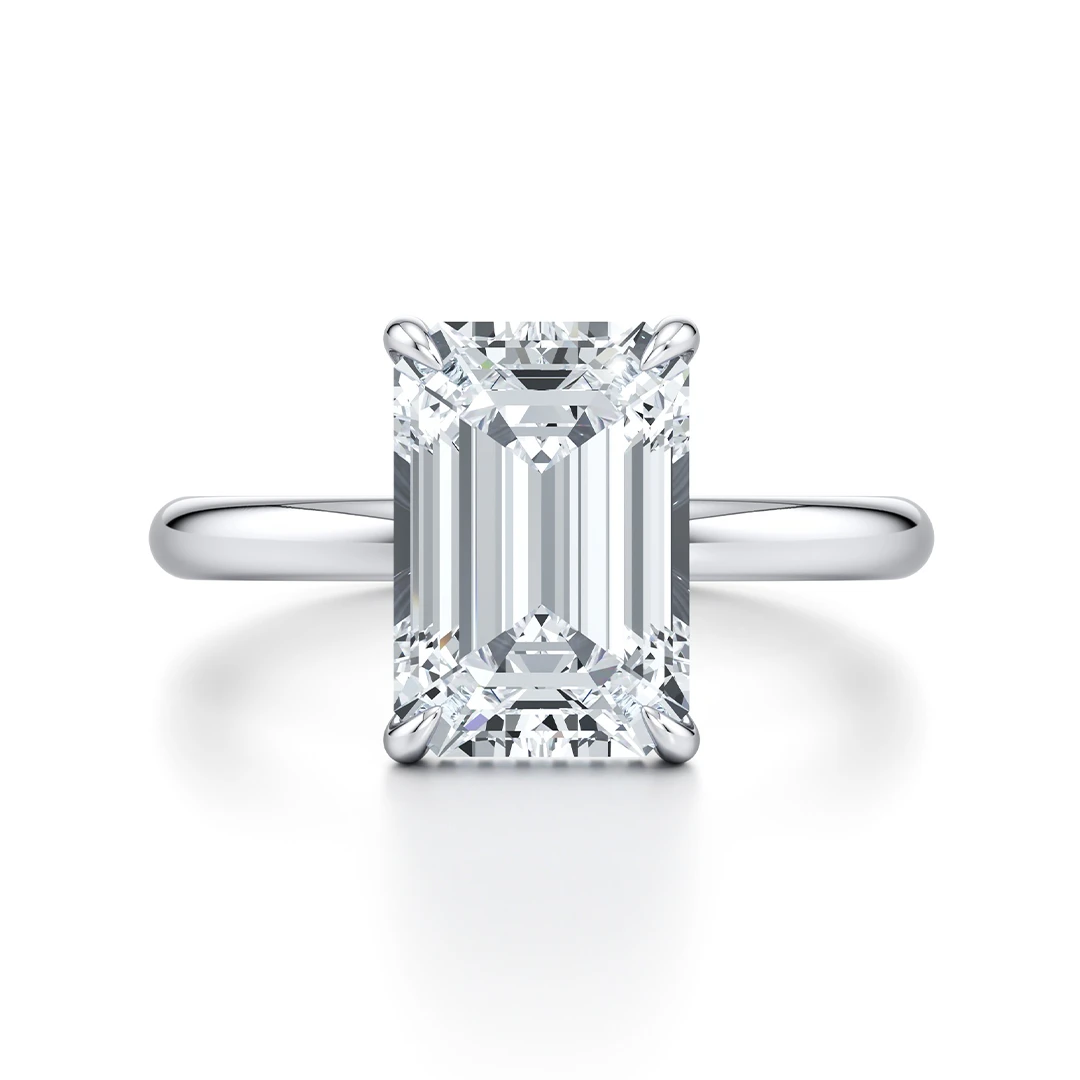 Classic Four-Prong Emerald Moissanite Ring