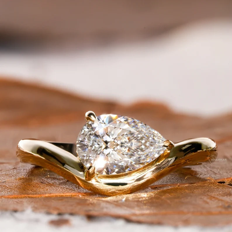 Classic Curved Pear Moissanite Ring