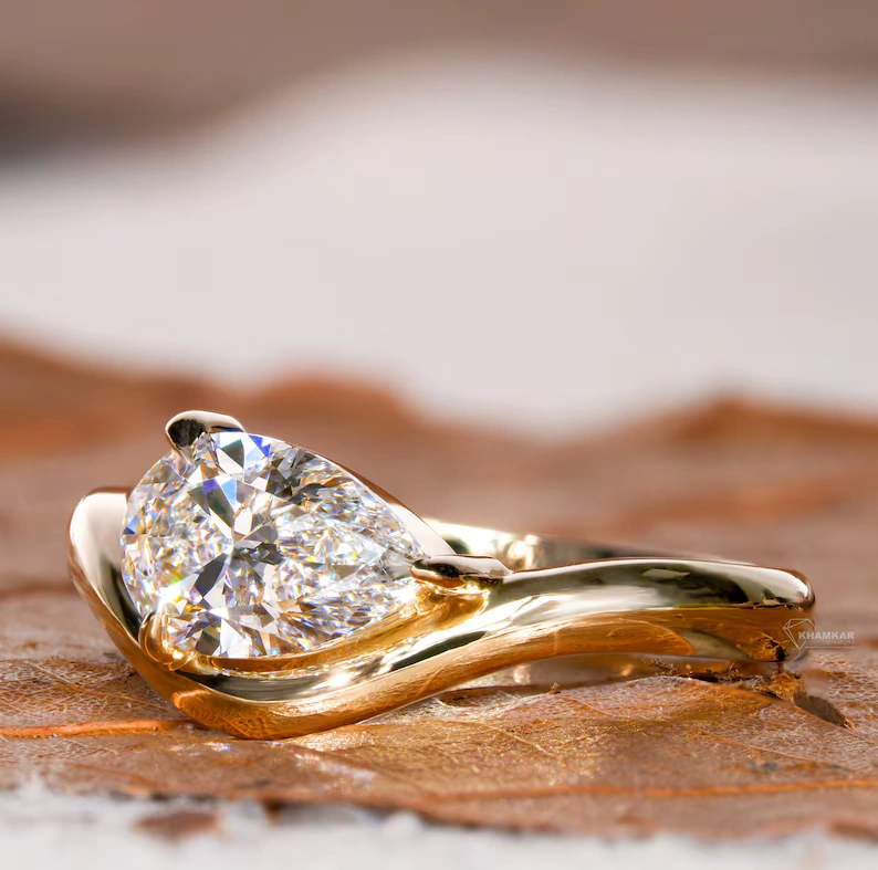 Classic Curved Pear Moissanite Ring