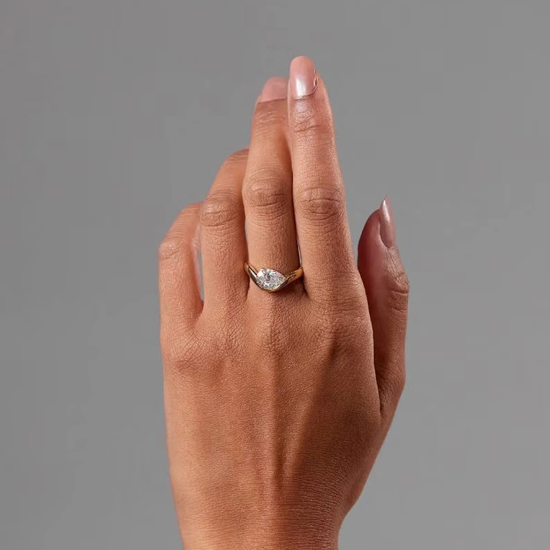 Classic Curved Pear Moissanite Ring