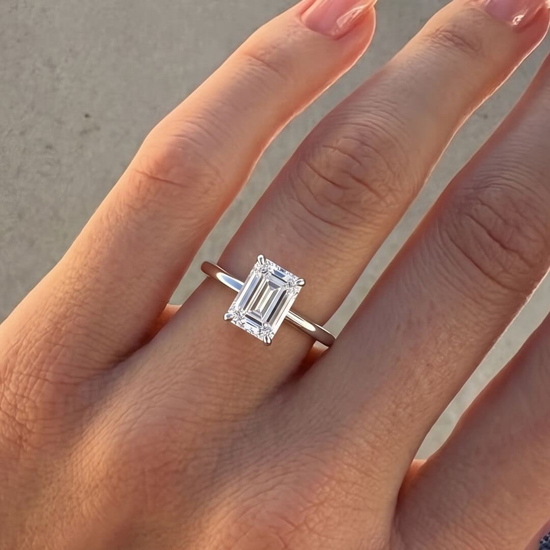Classic Four-Prong Emerald Moissanite Ring