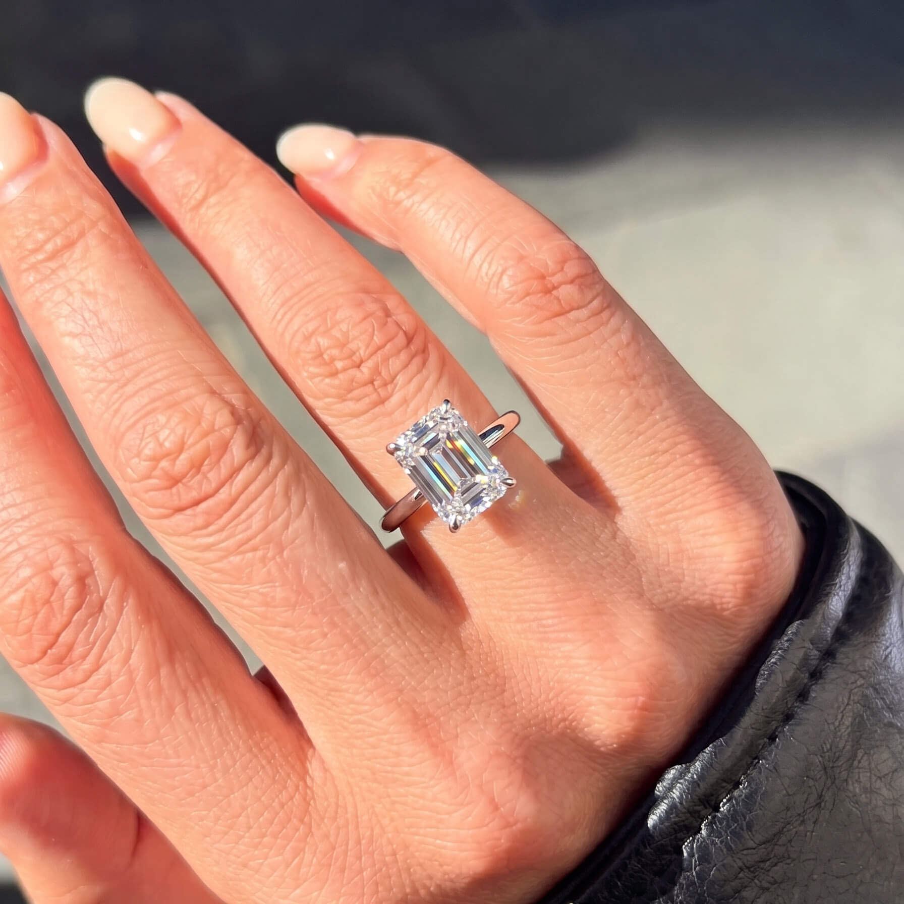 Classic Four-Prong Emerald Moissanite Ring