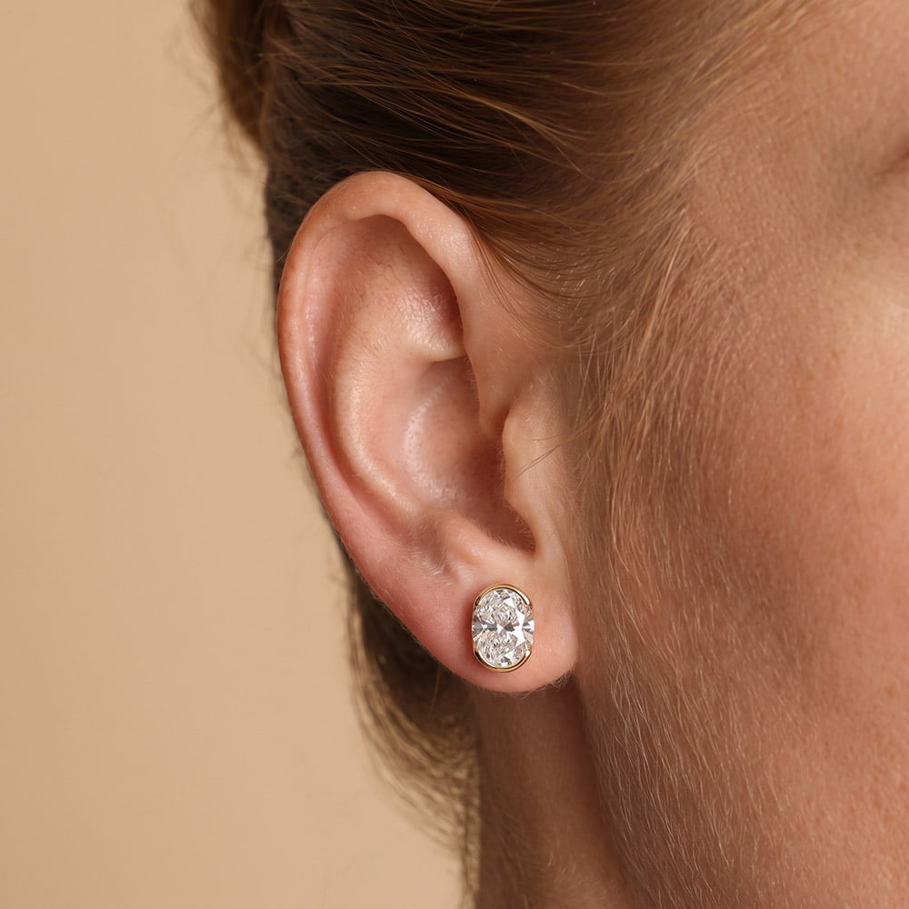 Half Bezel Oval Moissanite Stud Earrings