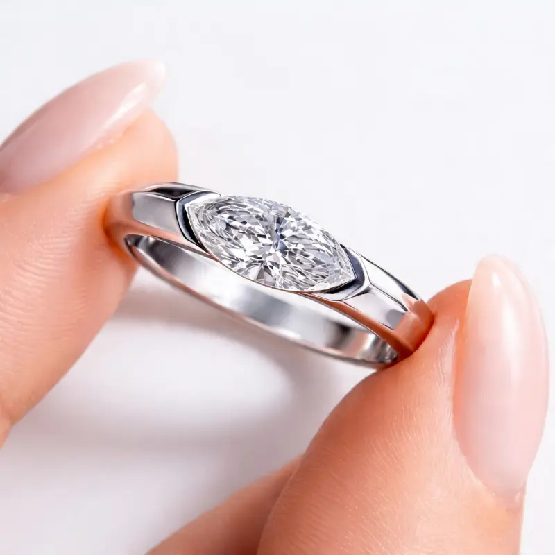 Half Bezel Marquise Moissanite Ring