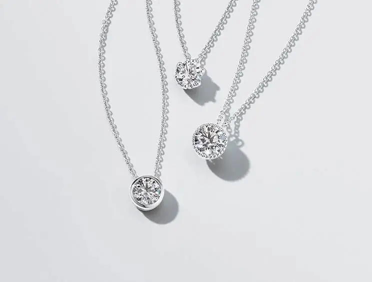 A stunning lineup of moissanite necklaces including tennis chains and diamond alternative pendants - VOOGMECHIC necklaces category cover