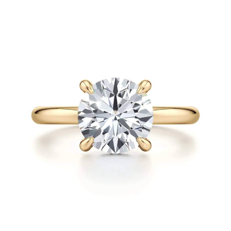 Classic Four-Prong Round Moissanite Ring