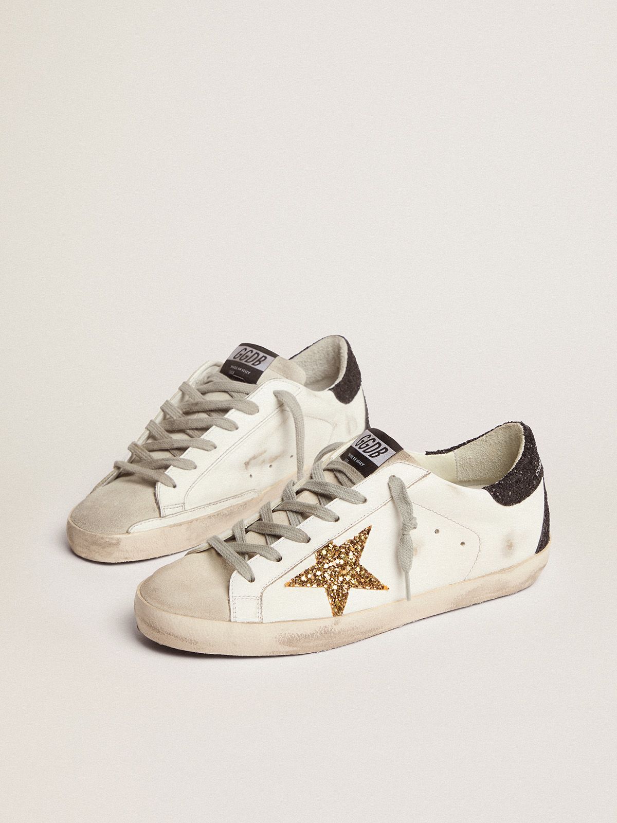 Sup-S sneakers with gold star and glittery black heel tab