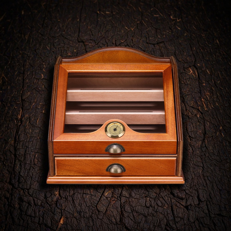 Front view of wood humidor cabinet with sloped glass lid and lower drawer