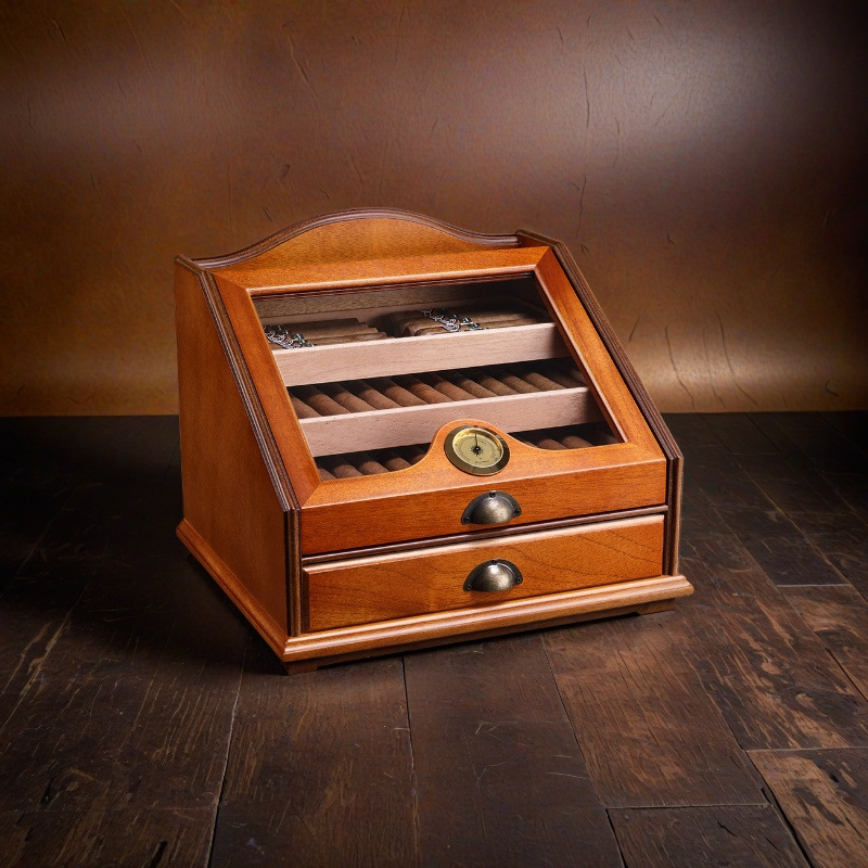 Angled view of glass-lid cigar humidor with front hygrometer
