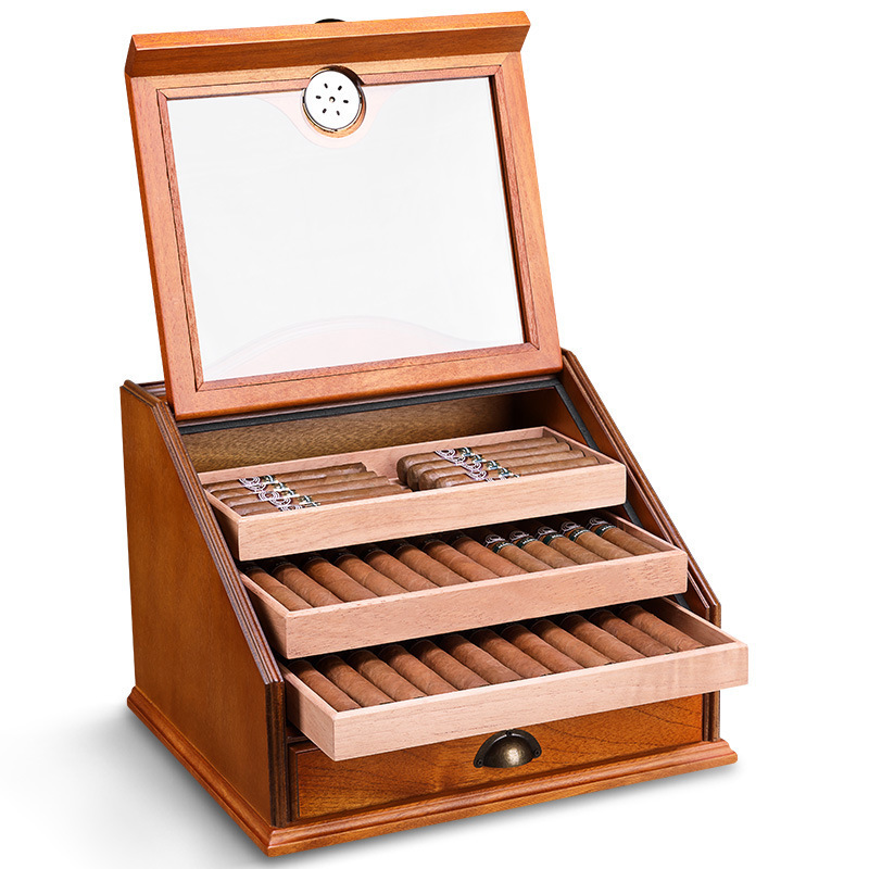 Open cedar display humidor with trays extended and cigars arranged inside