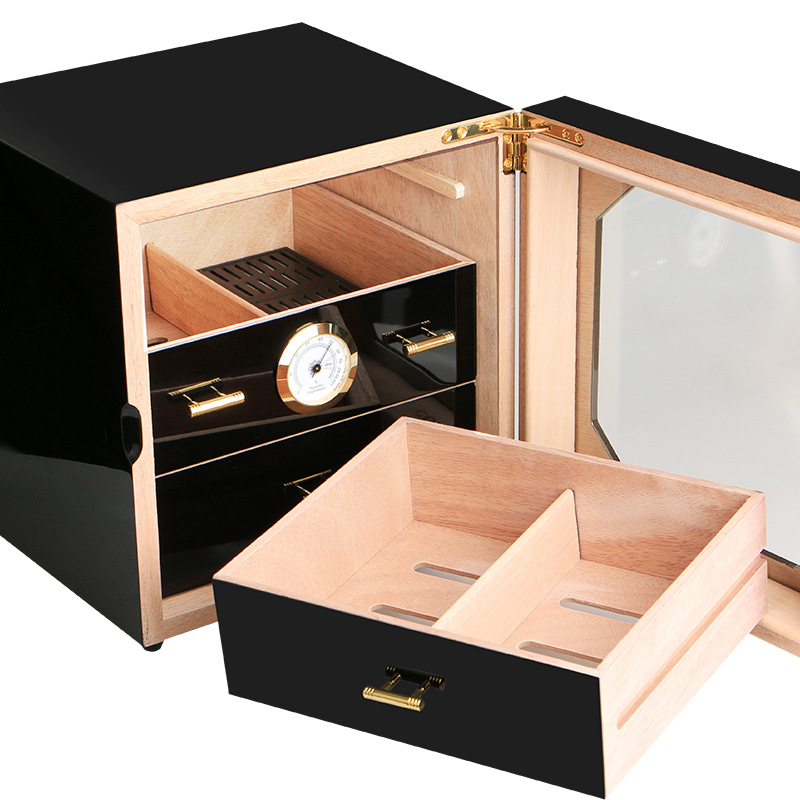 Pull-out wood-lined drawer and round hygrometer in black humidor cabinet