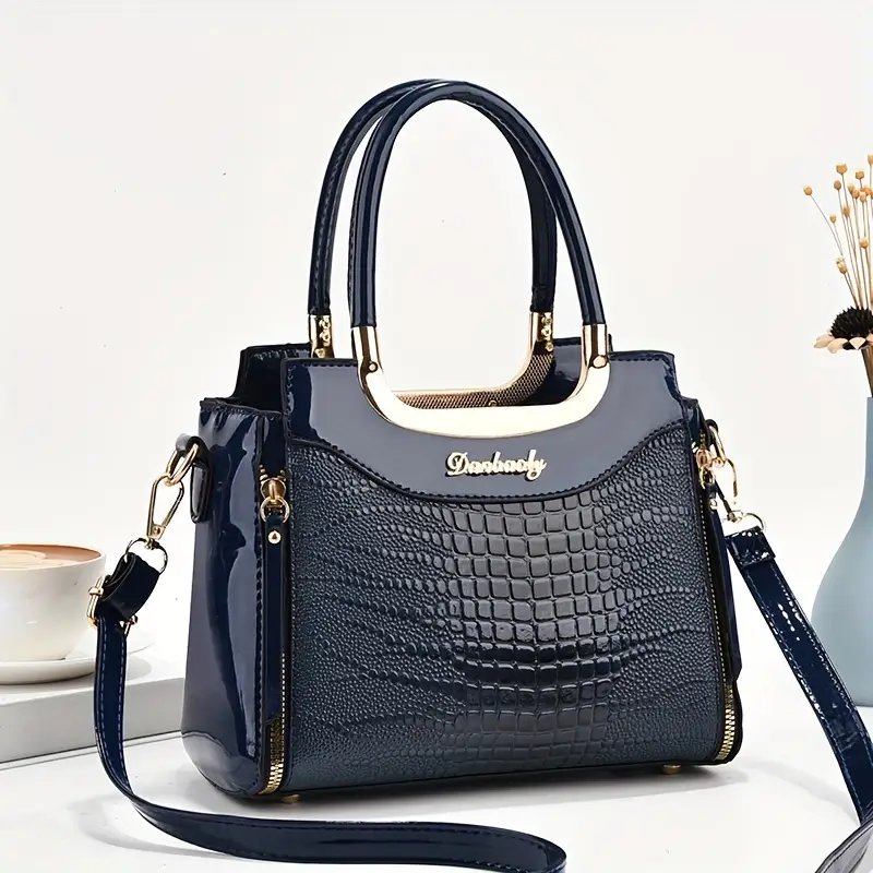 Elegante bolso de mano de piel de cocodrilo texturizada