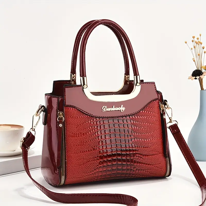 Elegante bolso de mano de piel de cocodrilo texturizada