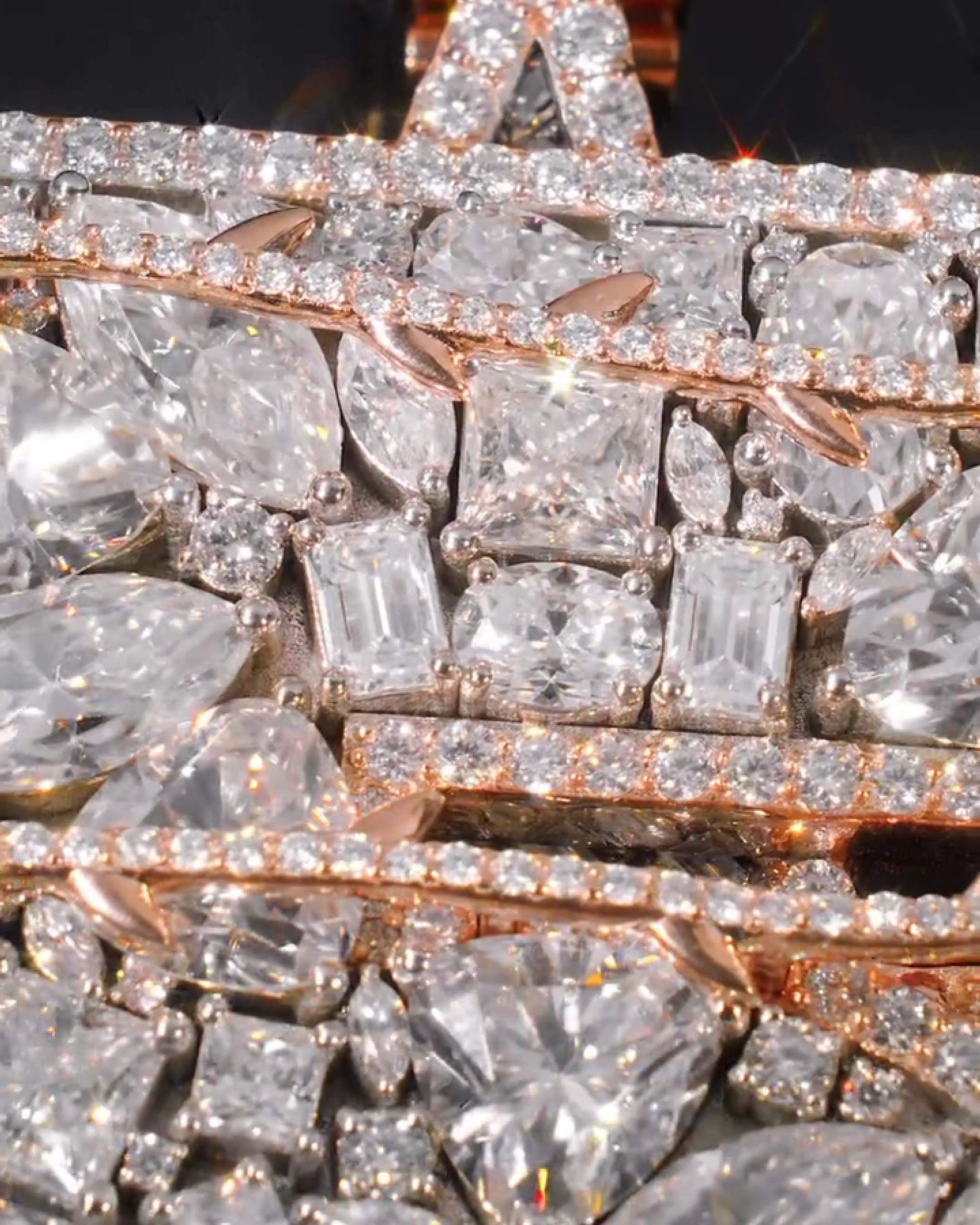 Close-up of moissanite stones and star detail on iced number 5 pendant
