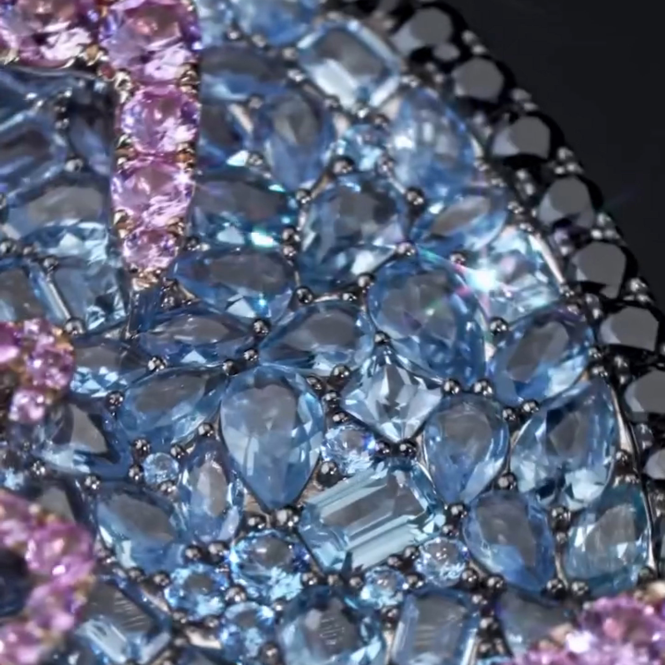 Close-up of purple diamond HEAR THIS MUSIC slogan on disc pendant