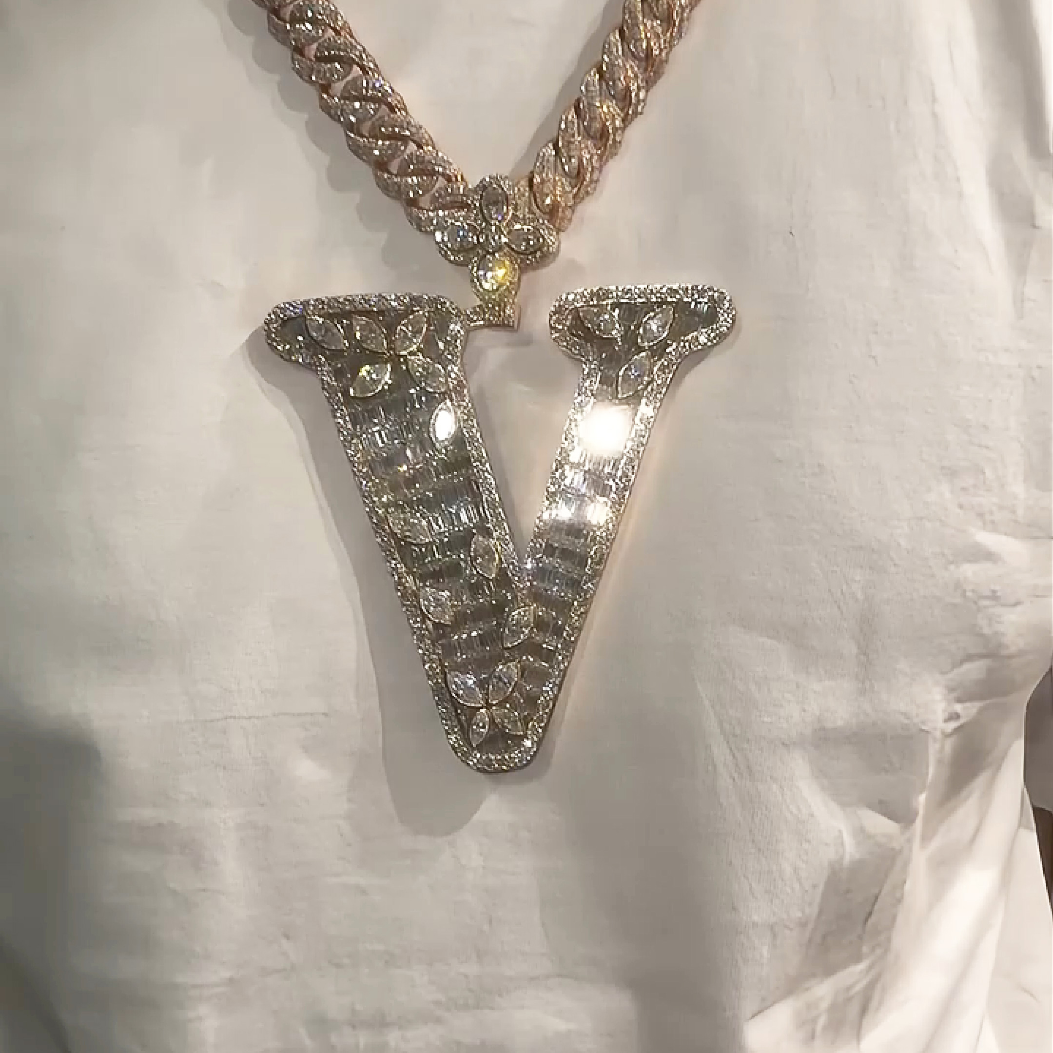 Man wearing Letter V pendant iced moissanite hip hop necklace