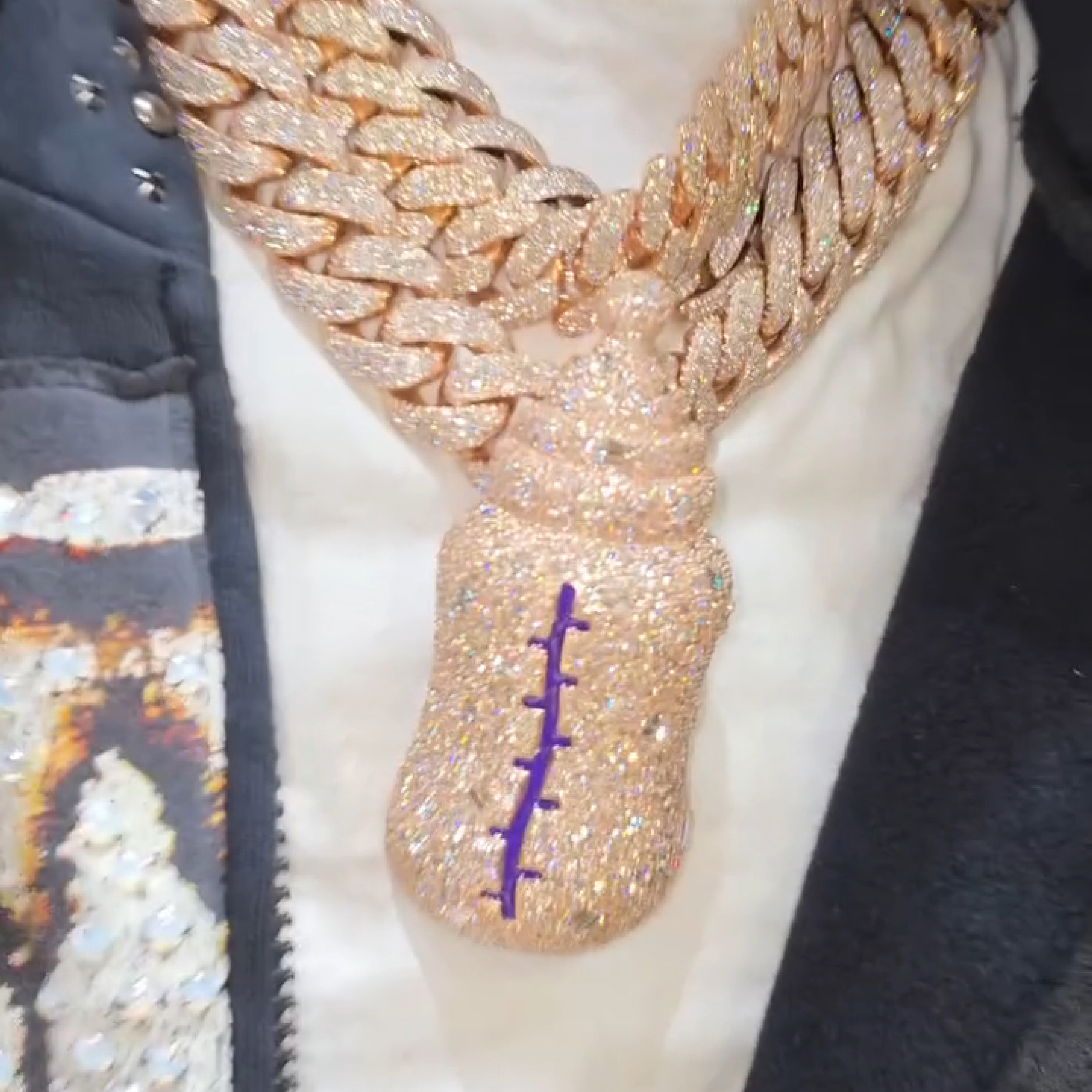 New Bottle pendant with emerald rounds, ovals, and pear-shaped gemstones
