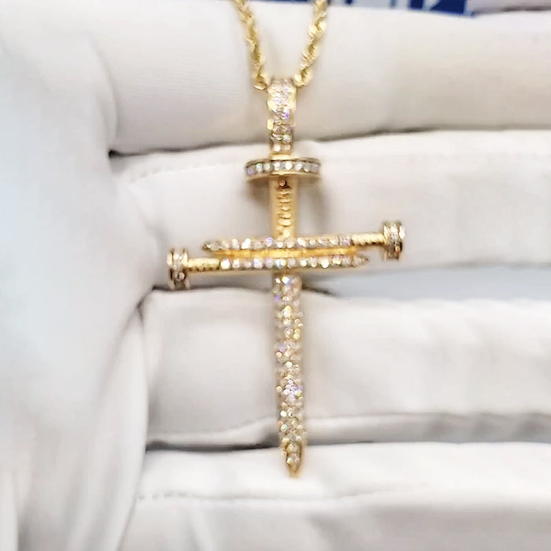 nail cross pendant close up craftsmanship detail luxury finish