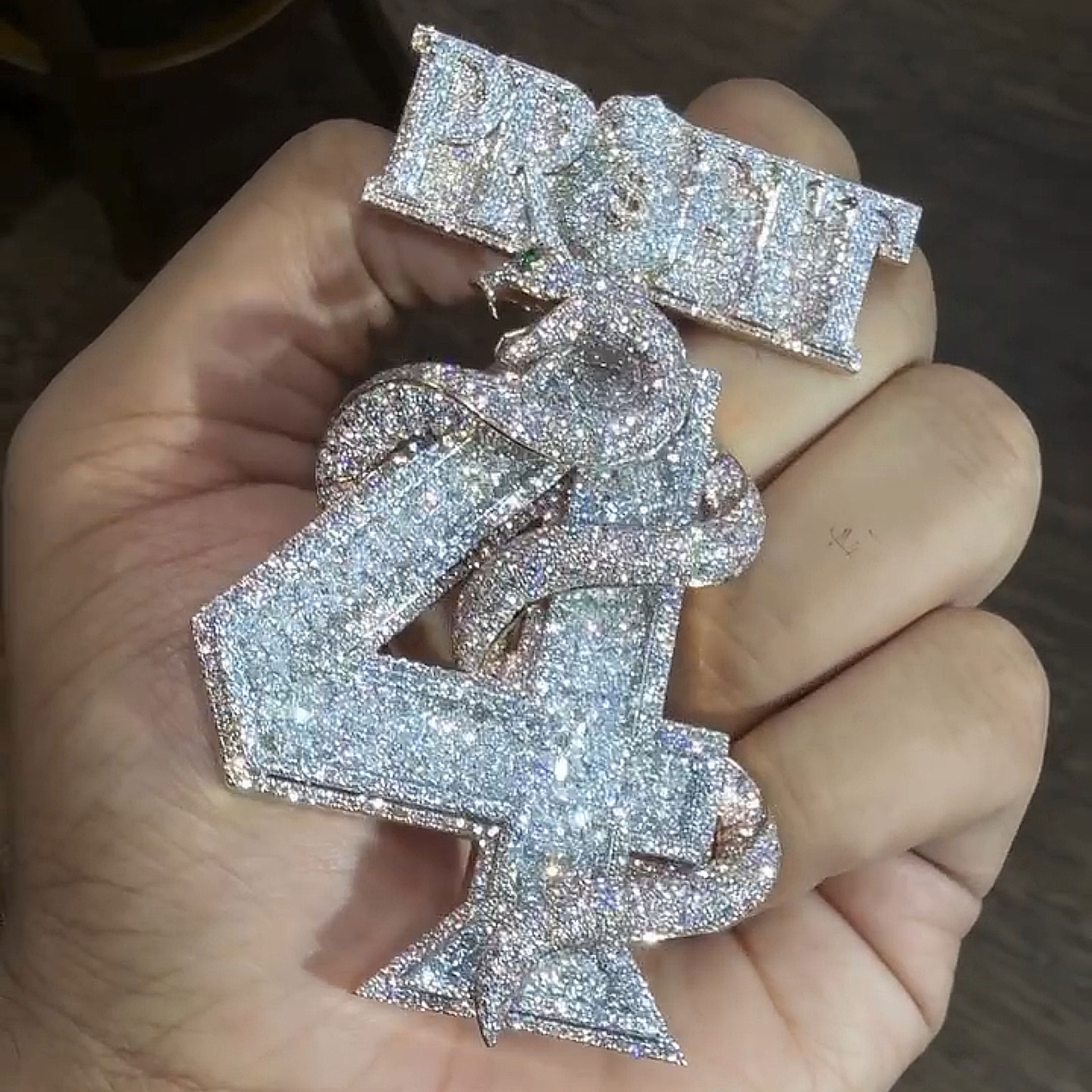 rose gold PROFIT coiled viper pendant front view luxury streetwear jewelry