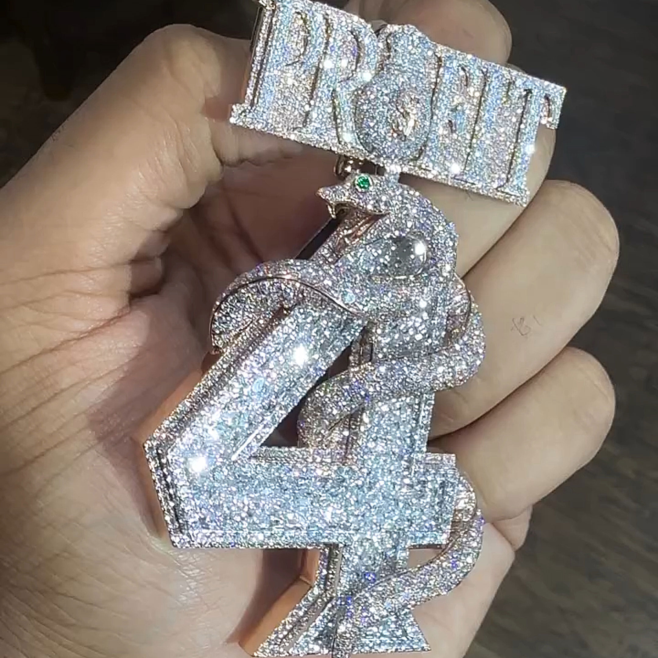 rose gold PROFIT coiled viper pendant angled view premium jewelry design