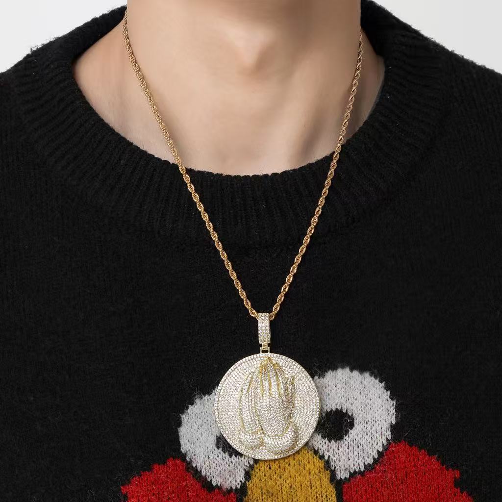 model wearing 3D praying hands disc pendant luxury streetwear fashion jewelry