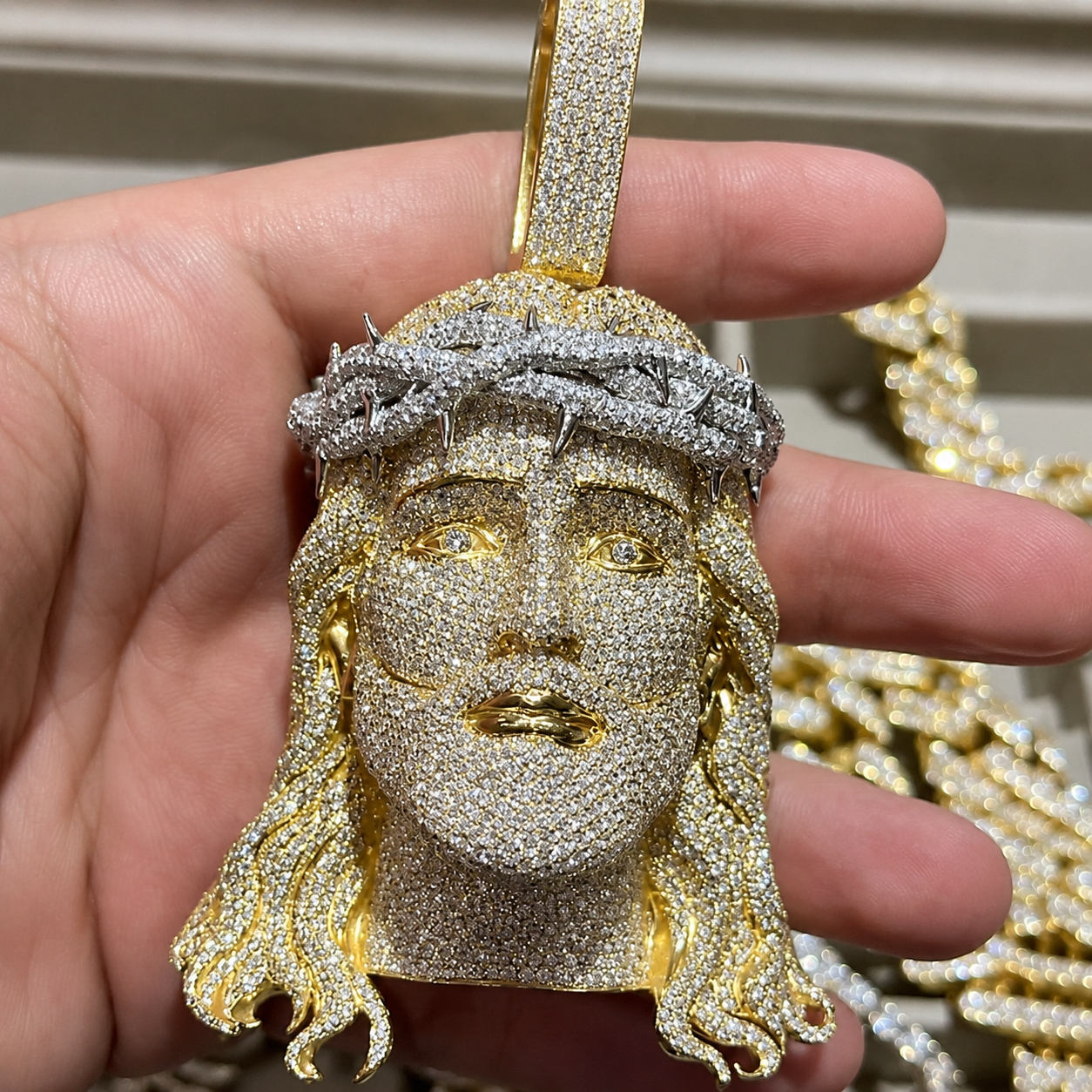 premium streetwear jewelry styling.
Gold-tone Jesus pendant  detailed religious-inspired craftsmanship.
