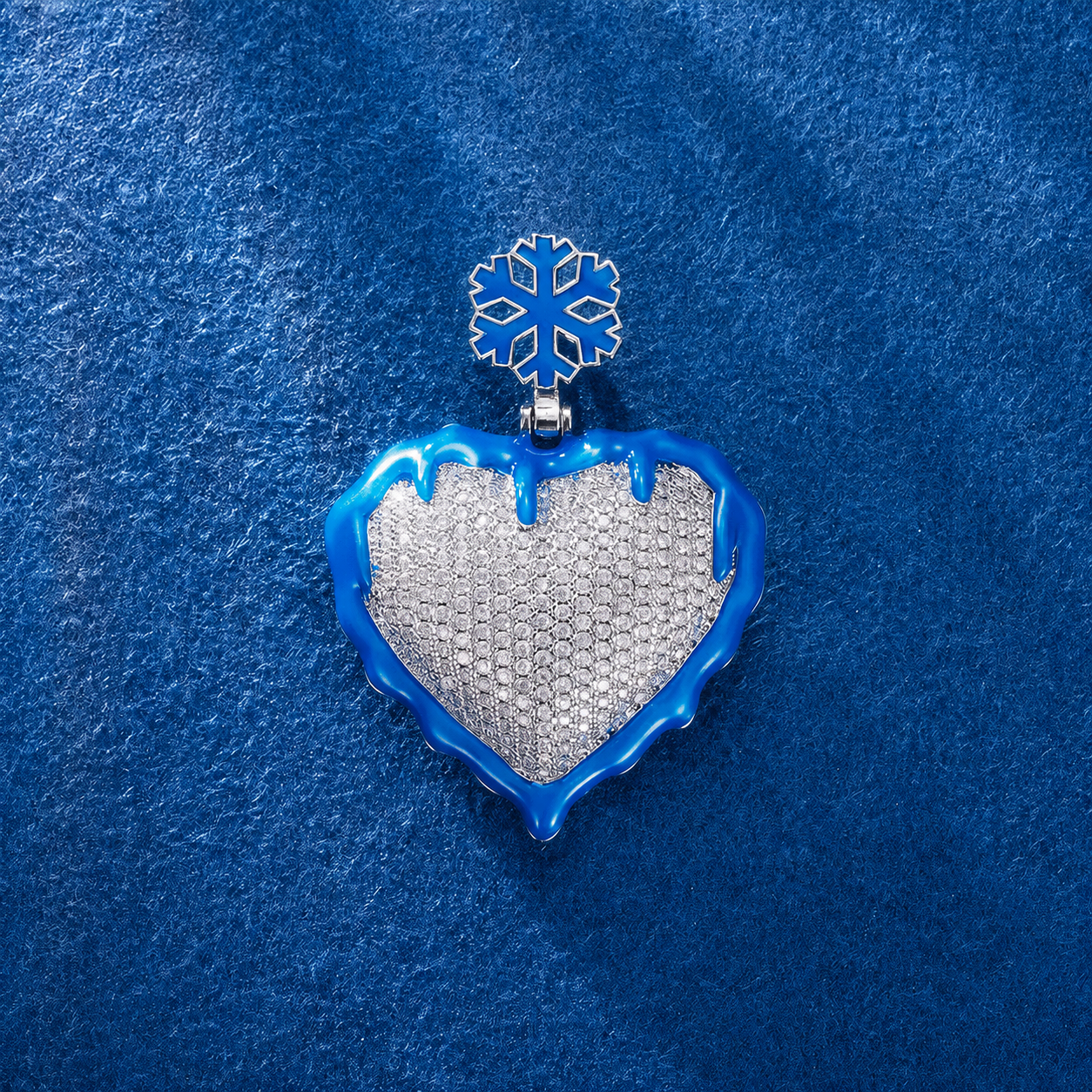 Iced out blue heart pendant with CZ diamonds in hip hop streetwear style