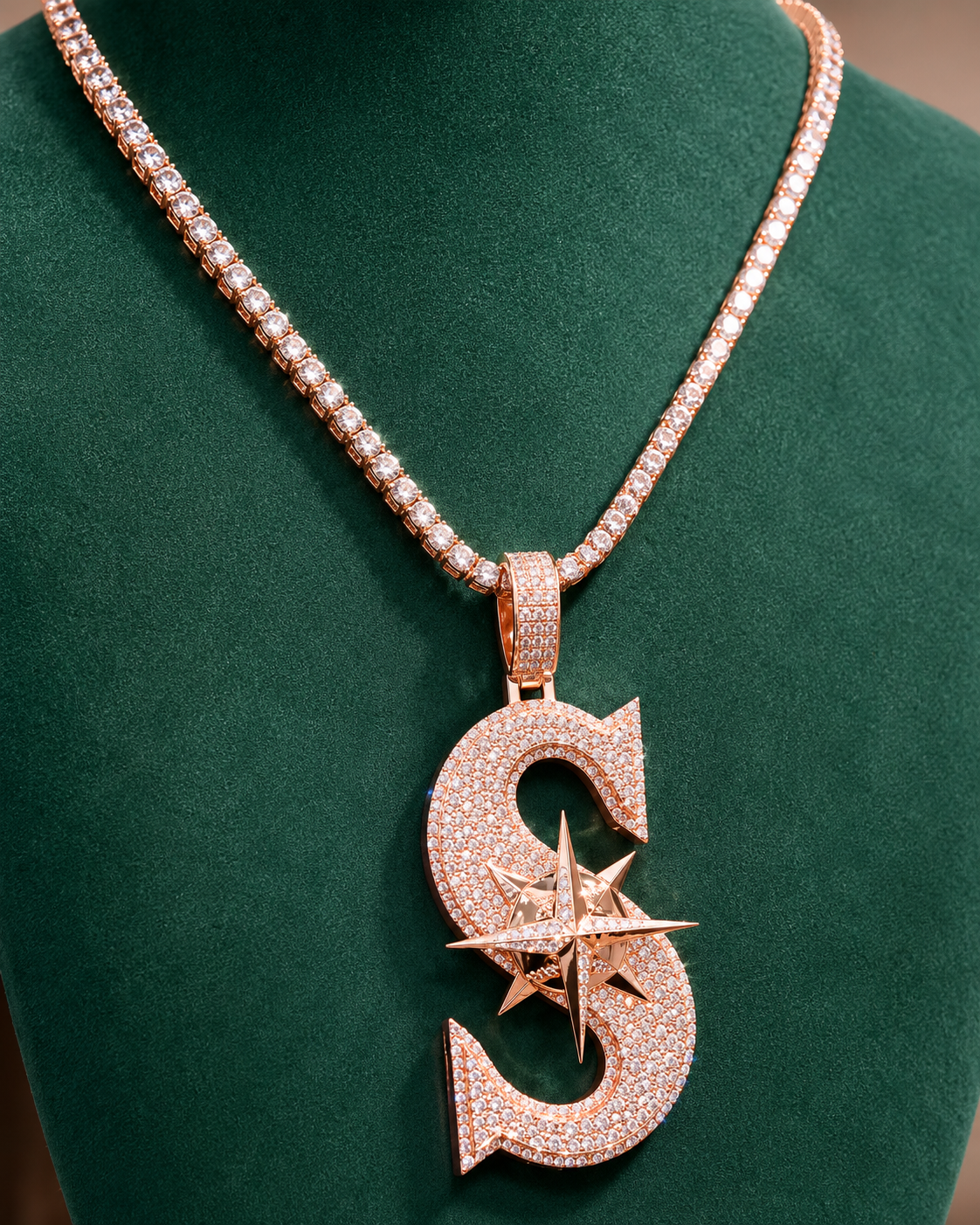 Iced out S pendant in rose gold with star compass design