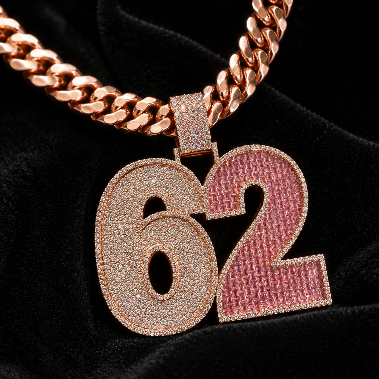 Rose gold 62 pendant on black velvet with clear CZ stones and pink stone setting.