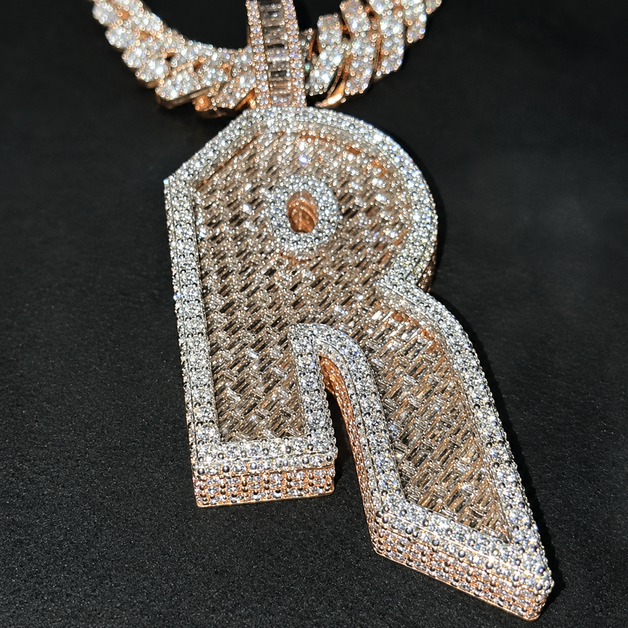 Iced-out letter R pendant with CZ, rose gold finish, and hip hop jewelry styling.